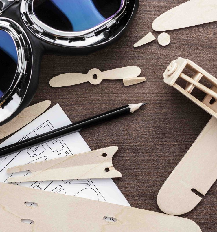 handmade-airplane-on-brown-wooden-table-2026-01-07-06-13-26-utc.jpg